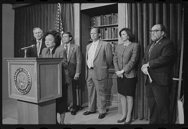 Patsy Mink became the first Asian American Congressional member in the 1960s; Laura Patterson, [Representative Patsy Mink announces the formation of the Congressional Asian Pacific American Caucus at a press conference with (left to right) Representatives Don Edwards and Norman Mineta, Guam Delegate Robert Underwood, and Representatives Nancy Pelosi and Neil Abercrombie], 1994, Roll Call portion of CQ Roll Call Photograph Collection, Prints and Photographs Division, Library of Congress